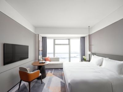 bedroom of deluxe hotel room